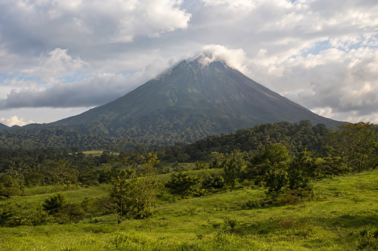 Arenal Volcano above the fields near La Fortuna