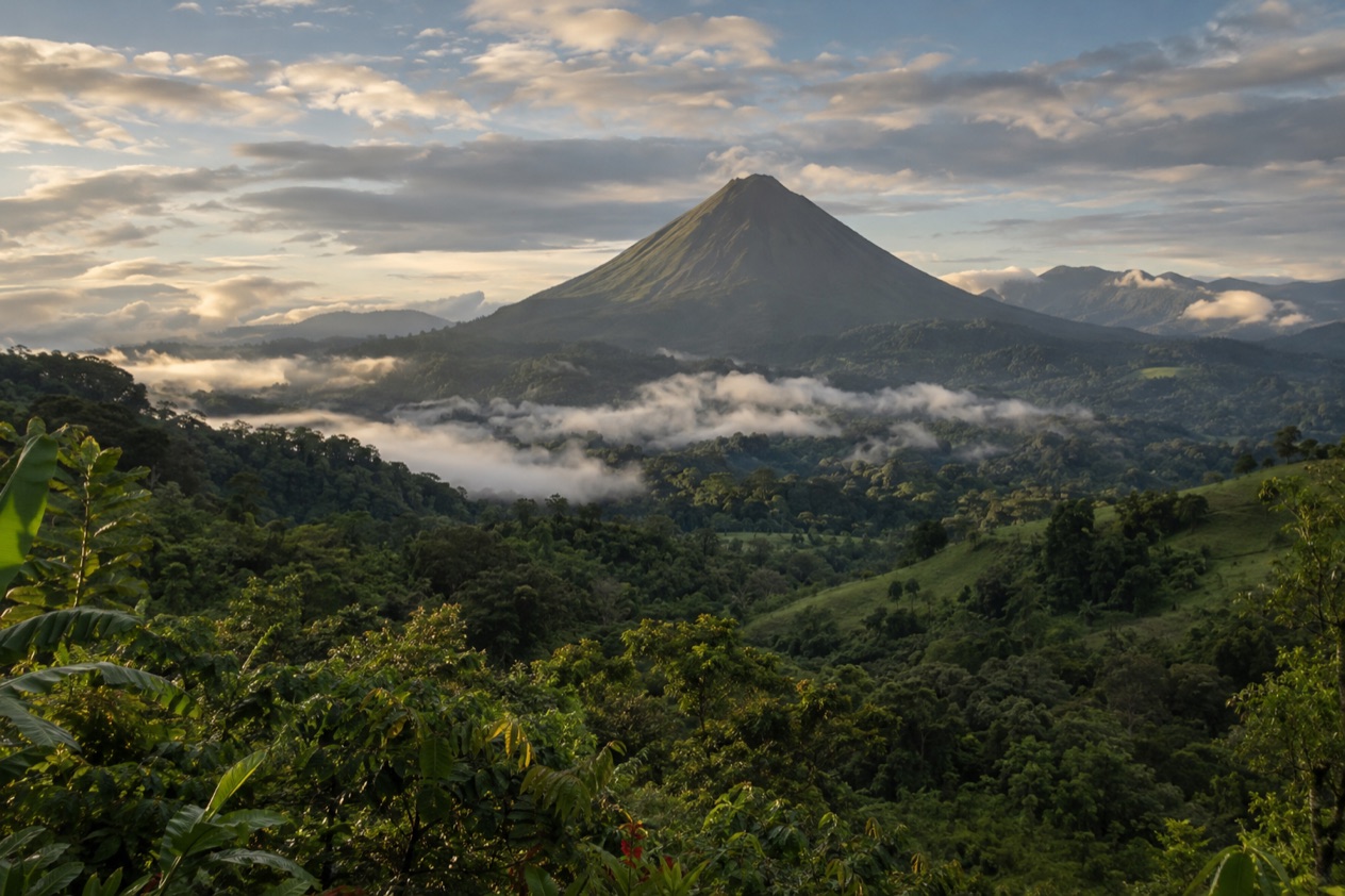Green hills and a volcano in Costa Rica