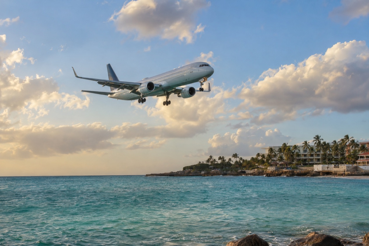 A plane arriving over the Caribbean coast